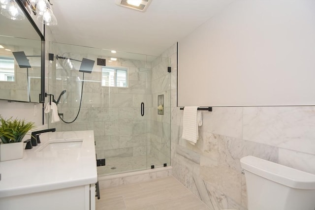 57 Garrison Ave Unit 57, Somerville, MA 02144 - full bathroom with tile walls, double vanity, and a stall shower