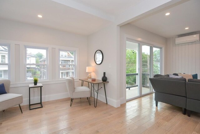 57 Garrison Ave Unit 57, Somerville, MA 02144 - living room featuring an AC wall unit, healthy amount of natural light, light wood-type flooring, and recessed lighting