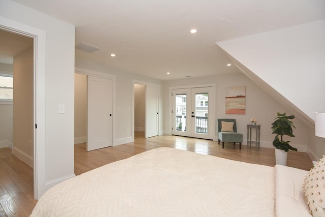 57 Garrison Ave Unit 57, Somerville, MA 02144 - bedroom featuring light wood-style flooring, multiple windows, recessed lighting, access to outside, and french doors