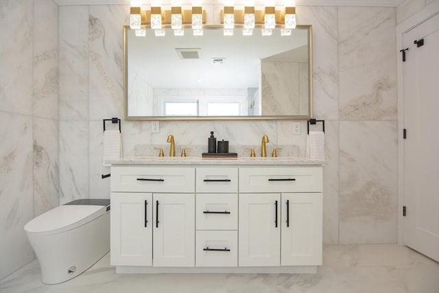 57 Garrison Ave Unit 57, Somerville, MA 02144 - bathroom featuring marble look tiles, tile walls, and double vanity