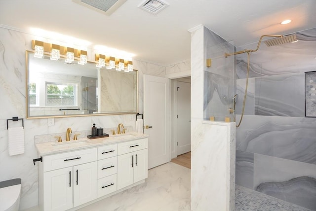 57 Garrison Ave Unit 57, Somerville, MA 02144 - bathroom with marble look tiles, a marble finish shower, and double vanity