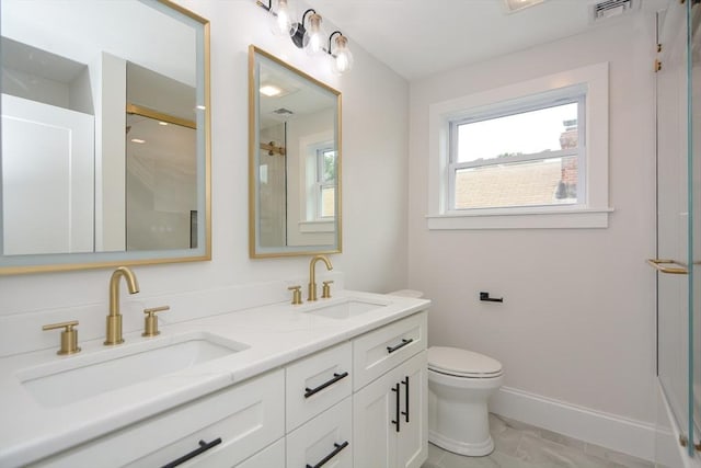 57 Garrison Ave Unit 57, Somerville, MA 02144 - bathroom featuring marble look tiles, double vanity, and a shower