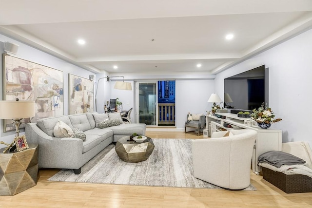 living room with wood finished floors, beamed ceiling, and recessed lighting