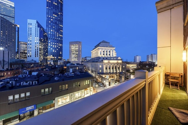balcony at night with a view of city lights