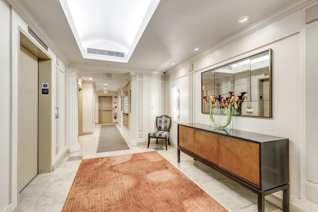 hallway with elevator, visible vents, crown molding, and ornate columns