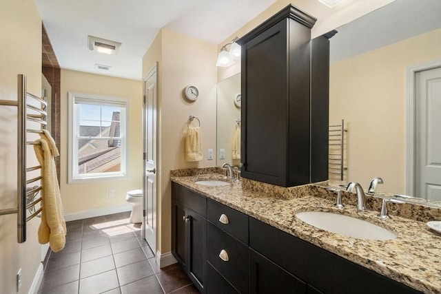 16 Boatwrights Loop, Plymouth, MA 02360 - bathroom with tile patterned floors, toilet, baseboards, and a sink