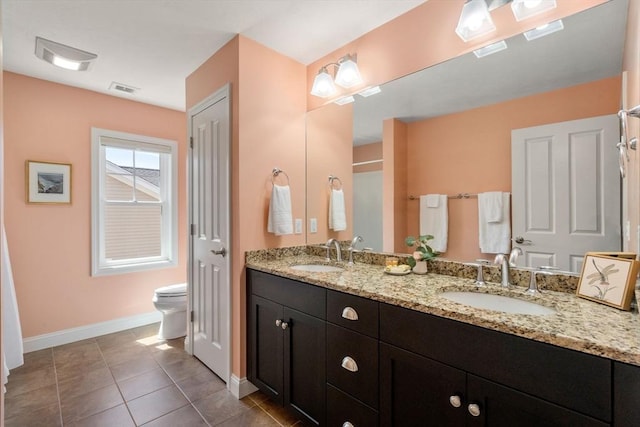 16 Boatwrights Loop, Plymouth, MA 02360 - bathroom featuring double vanity, visible vents, baseboards, and a sink