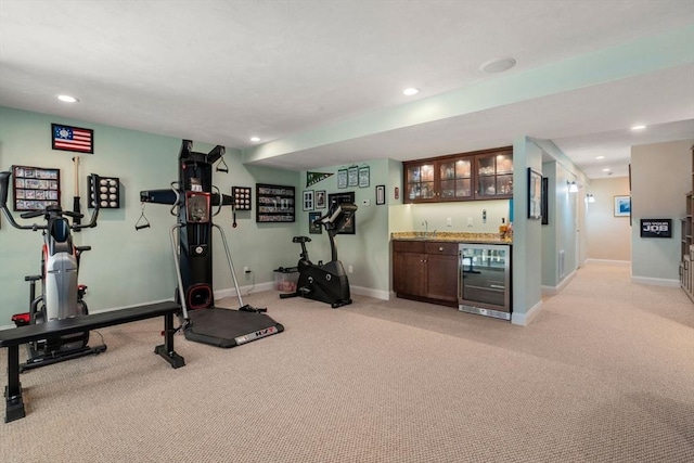 16 Boatwrights Loop, Plymouth, MA 02360 - workout room with light colored carpet, baseboards, indoor wet bar, and beverage cooler