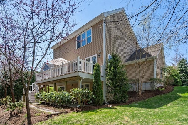 16 Boatwrights Loop, Plymouth, MA 02360 - back of property featuring a yard, stairway, and a wooden deck