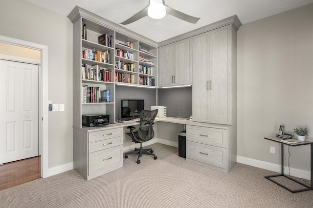 16 Boatwrights Loop, Plymouth, MA 02360 - home office with a ceiling fan, light carpet, built in desk, and baseboards