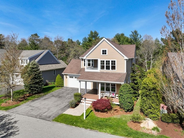 16 Boatwrights Loop, Plymouth, MA 02360 - view of front of home with driveway, a porch, and a front lawn