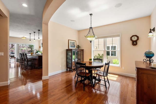 16 Boatwrights Loop, Plymouth, MA 02360 - dining space with baseboards, hardwood / wood-style floors, and arched walkways