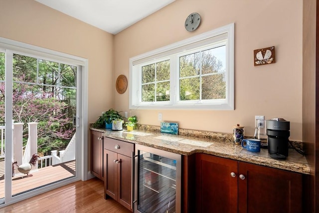 16 Boatwrights Loop, Plymouth, MA 02360 - bar featuring beverage cooler, a dry bar, and light wood-style flooring