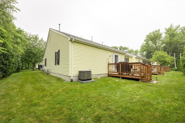 65 Bliss Ave Unit 4, Attleboro, MA 02703 - back of property featuring a wooden deck and a yard