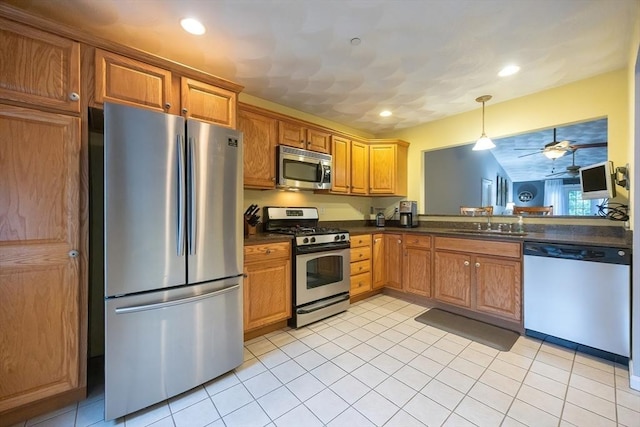65 Bliss Ave Unit 4, Attleboro, MA 02703 - kitchen with stainless steel appliances, dark countertops, ceiling fan, decorative light fixtures, and light tile patterned floors