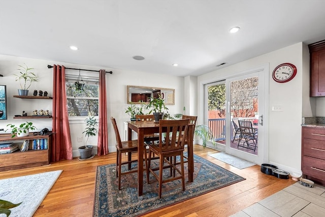 dining space featuring recessed lighting, light wood-style flooring, and a healthy amount of sunlight