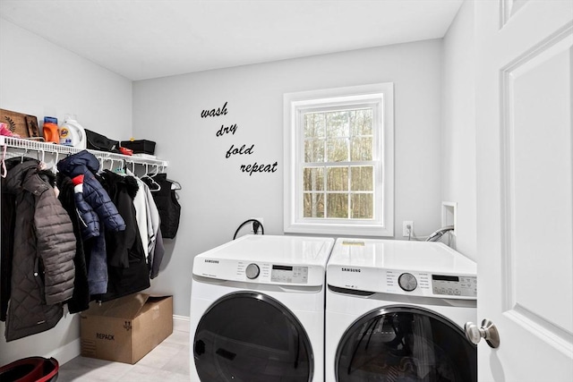 laundry area with washing machine and dryer