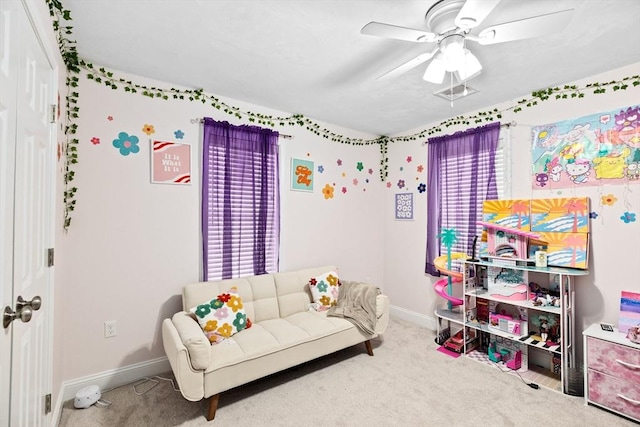 interior space with ceiling fan and carpet