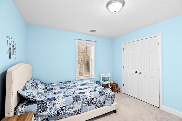 bedroom featuring a closet and carpet