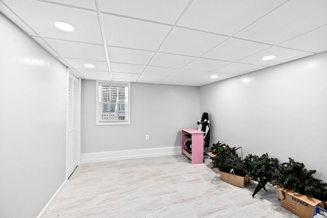 basement featuring a drop ceiling