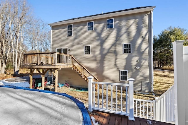 back of house featuring a wooden deck