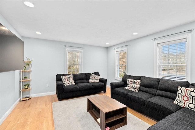 living room with light hardwood / wood-style flooring