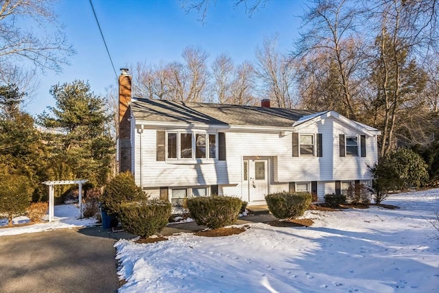 split foyer home with a pergola