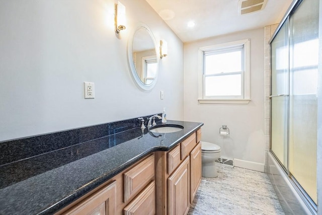 full bathroom with shower / bath combination with glass door, vanity, and toilet