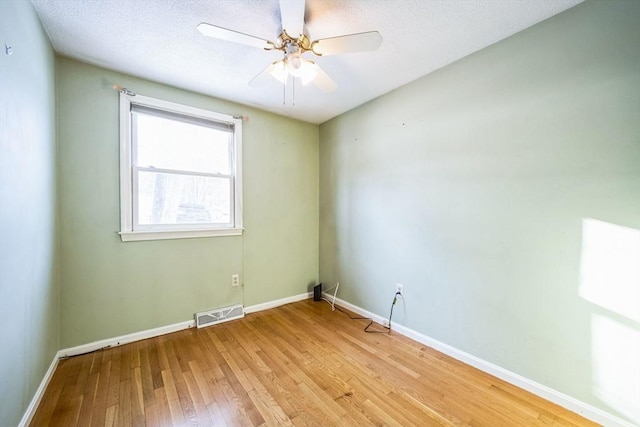 unfurnished room with ceiling fan and light hardwood / wood-style flooring