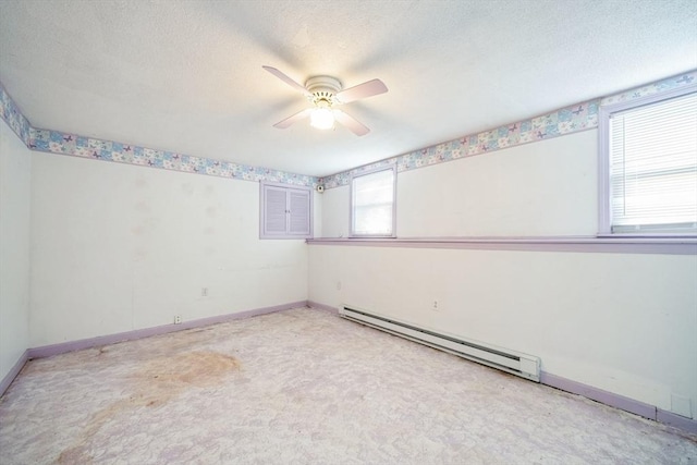 unfurnished room featuring a baseboard heating unit, a textured ceiling, and ceiling fan