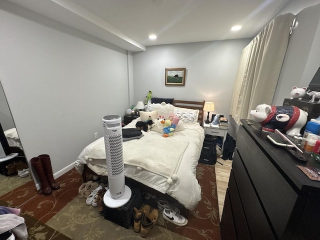 bedroom with hardwood / wood-style flooring