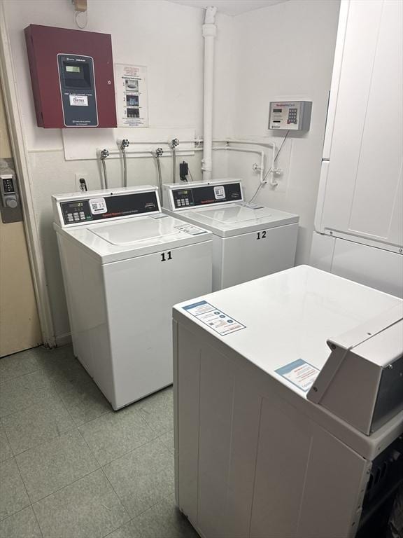 laundry room with separate washer and dryer