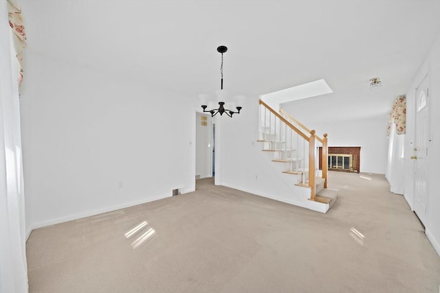 2 Winstead Rd, Weymouth, MA 02189 - carpeted foyer featuring a chandelier, stairway, baseboards, and a brick fireplace