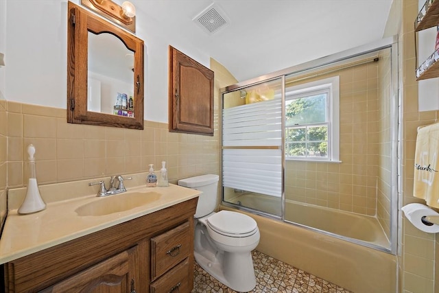 2 Winstead Rd, Weymouth, MA 02189 - full bathroom with vanity, tile walls, toilet, combined bath / shower with glass door, and tile patterned floors