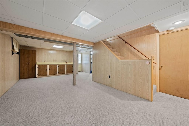 2 Winstead Rd, Weymouth, MA 02189 - basement featuring wood walls, carpet, a drop ceiling, and stairway