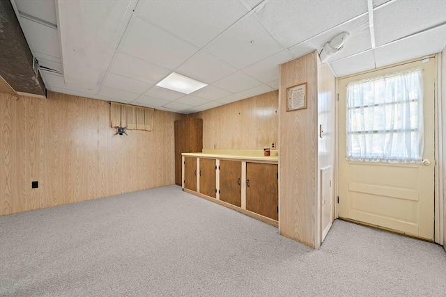 2 Winstead Rd, Weymouth, MA 02189 - basement featuring light carpet, wooden walls, and a paneled ceiling