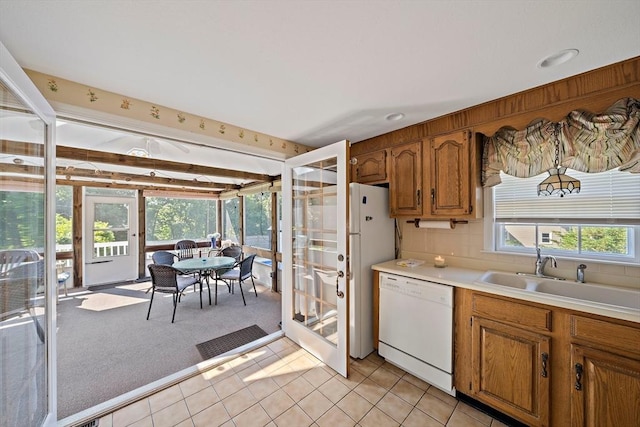 2 Winstead Rd, Weymouth, MA 02189 - kitchen featuring white appliances, a sink, light carpet, light countertops, and brown cabinets