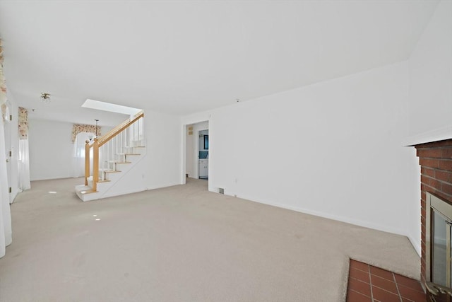 2 Winstead Rd, Weymouth, MA 02189 - unfurnished living room featuring carpet, stairway, and a fireplace