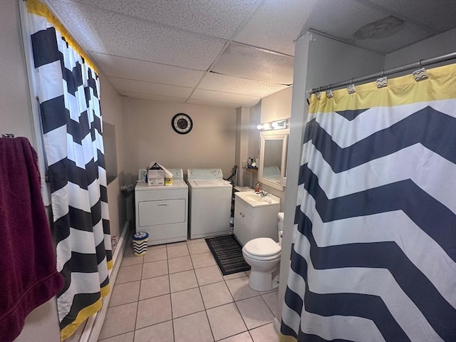 full bath with tile patterned flooring, a drop ceiling, a sink, independent washer and dryer, and a shower with shower curtain