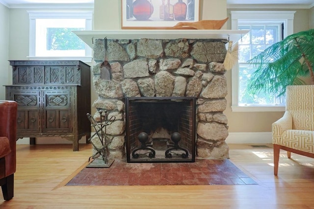 95 Glendale Rd, Sharon, MA 02067 - detailed view of wood finished floors, a fireplace, and crown molding