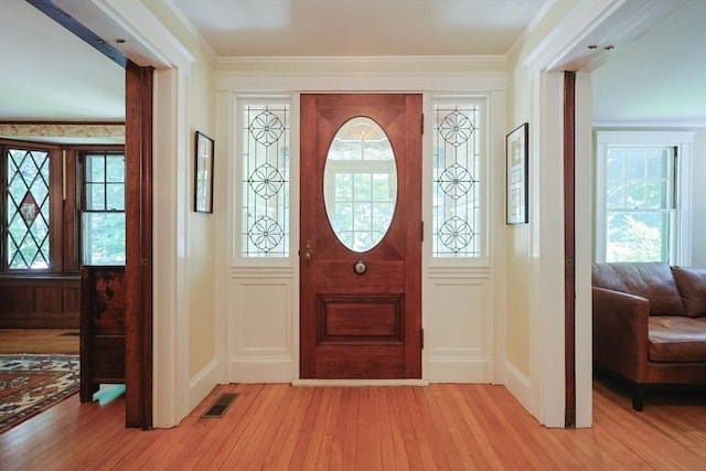 95 Glendale Rd, Sharon, MA 02067 - entryway featuring light wood-type flooring, plenty of natural light, and crown molding