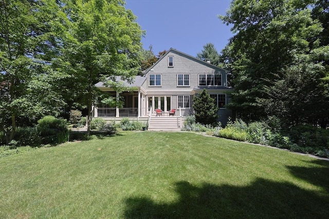 95 Glendale Rd, Sharon, MA 02067 - back of property featuring a lawn and a sunroom