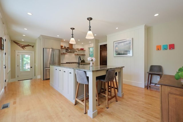 95 Glendale Rd, Sharon, MA 02067 - kitchen featuring freestanding refrigerator, open shelves, light wood-type flooring, stone counters, and recessed lighting