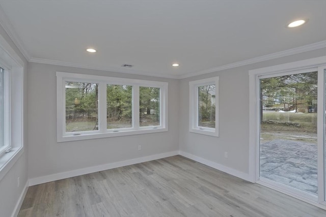 unfurnished room featuring visible vents, baseboards, light wood-style flooring, crown molding, and recessed lighting