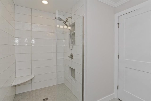 bathroom featuring recessed lighting, a tile shower, and crown molding