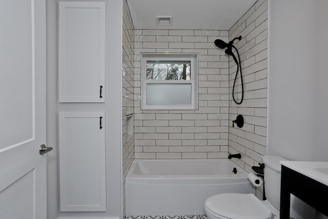 bathroom with visible vents, washtub / shower combination, vanity, and toilet