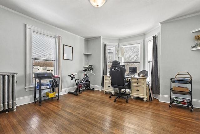 home office with baseboards, dark wood-type flooring, ornamental molding, and radiator