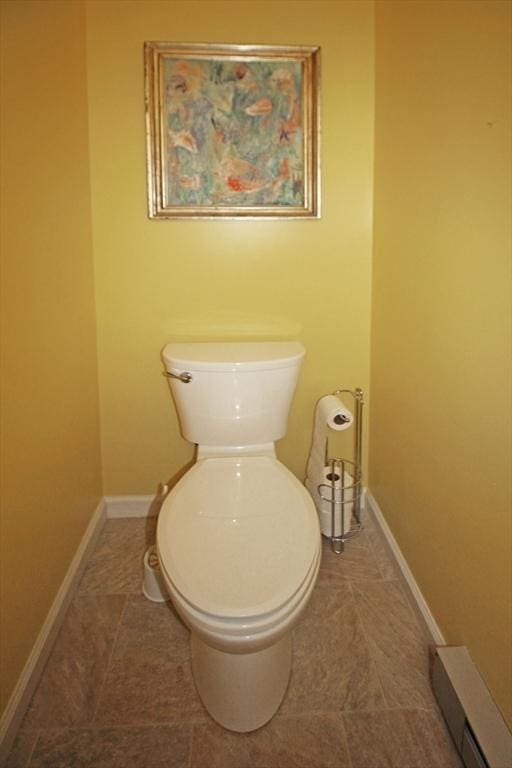 575 Bridge Rd Unit 11-2, Northampton, MA 01060 - bathroom with toilet, baseboards, and tile patterned flooring