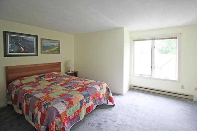 575 Bridge Rd Unit 11-2, Northampton, MA 01060 - bedroom with a baseboard heating unit and carpet floors