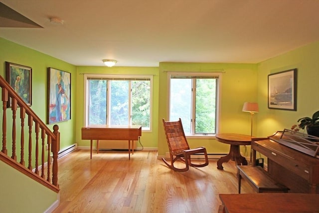 575 Bridge Rd Unit 11-2, Northampton, MA 01060 - sitting room with plenty of natural light, light wood-style flooring, baseboards, and stairs